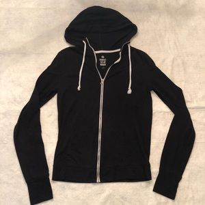 Black full-zip sweatshirt with thumb holes